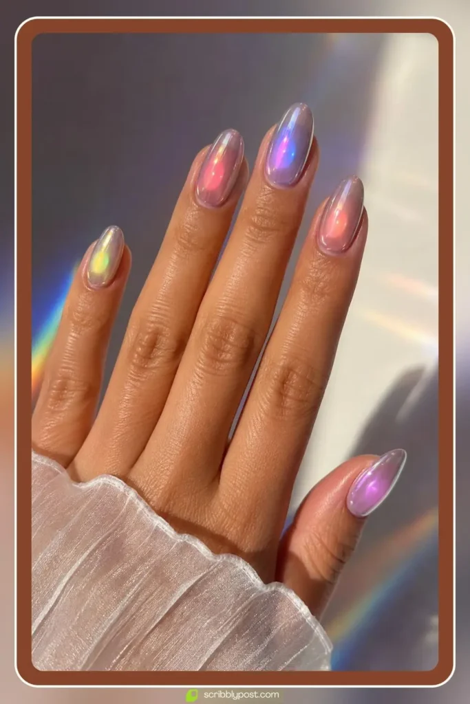 Aura chrome nails with a glowing color orb blended at the center of each nail