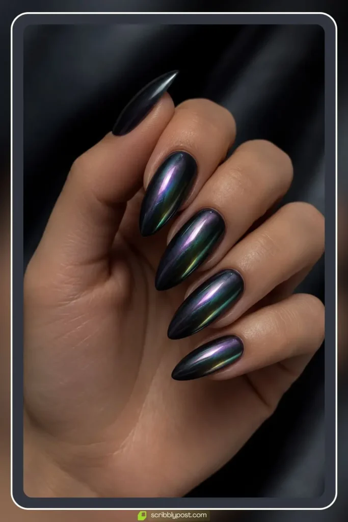 Deep charcoal nails with black pearl chrome creating a dark oil slick iridescence