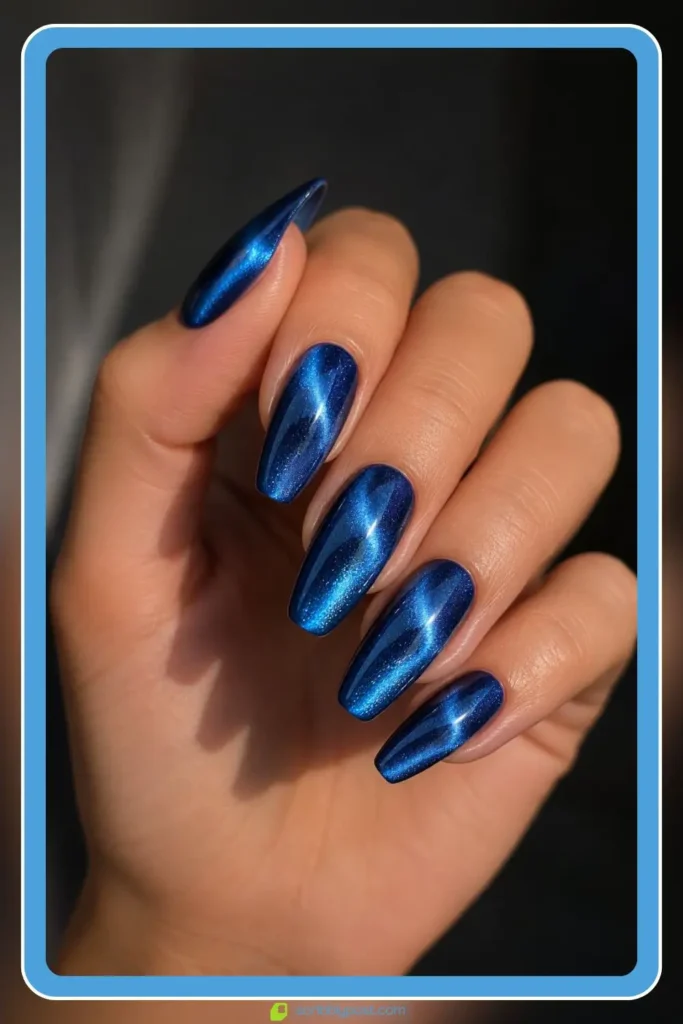 magnetic chrome blue cat eye gel nails with metallic ripple on medium length