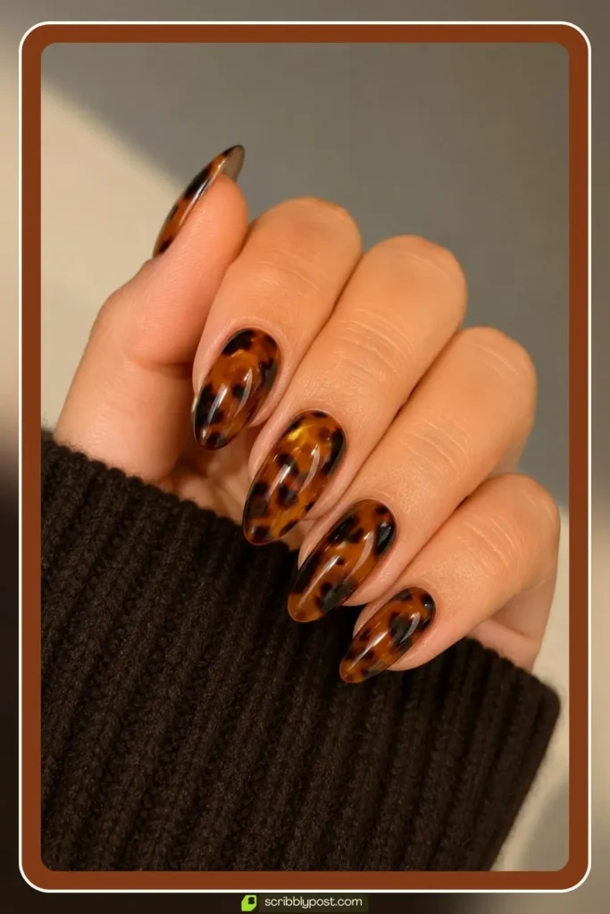 Almond nails with classic amber and brown tortoise shell pattern in translucent layers