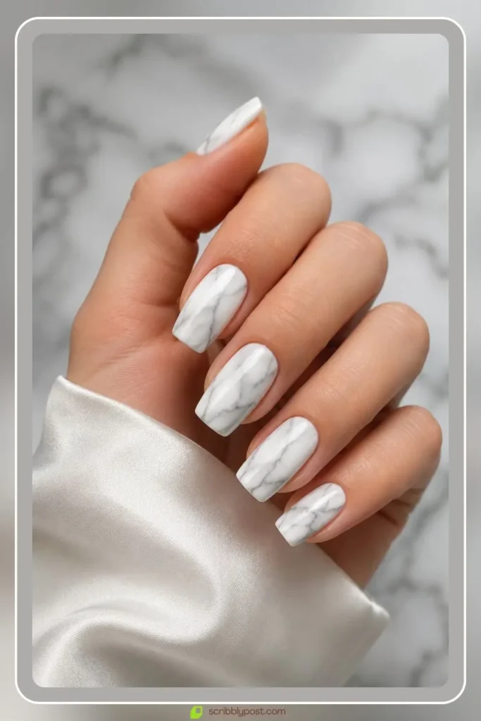 Classic grey veined marble nails on oval shape with thin brushed veins on white gel base