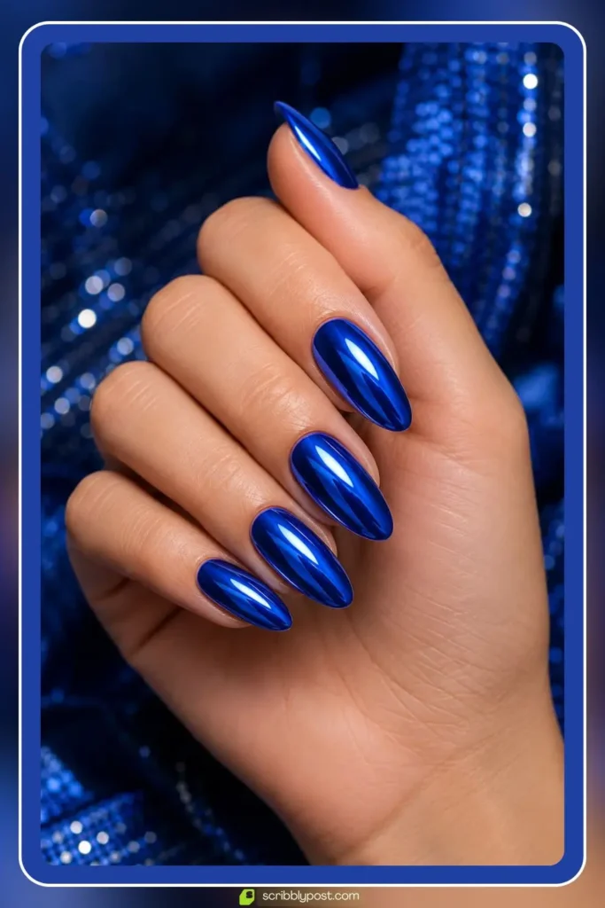Bright cobalt blue chrome nails with deep saturated mirror shine