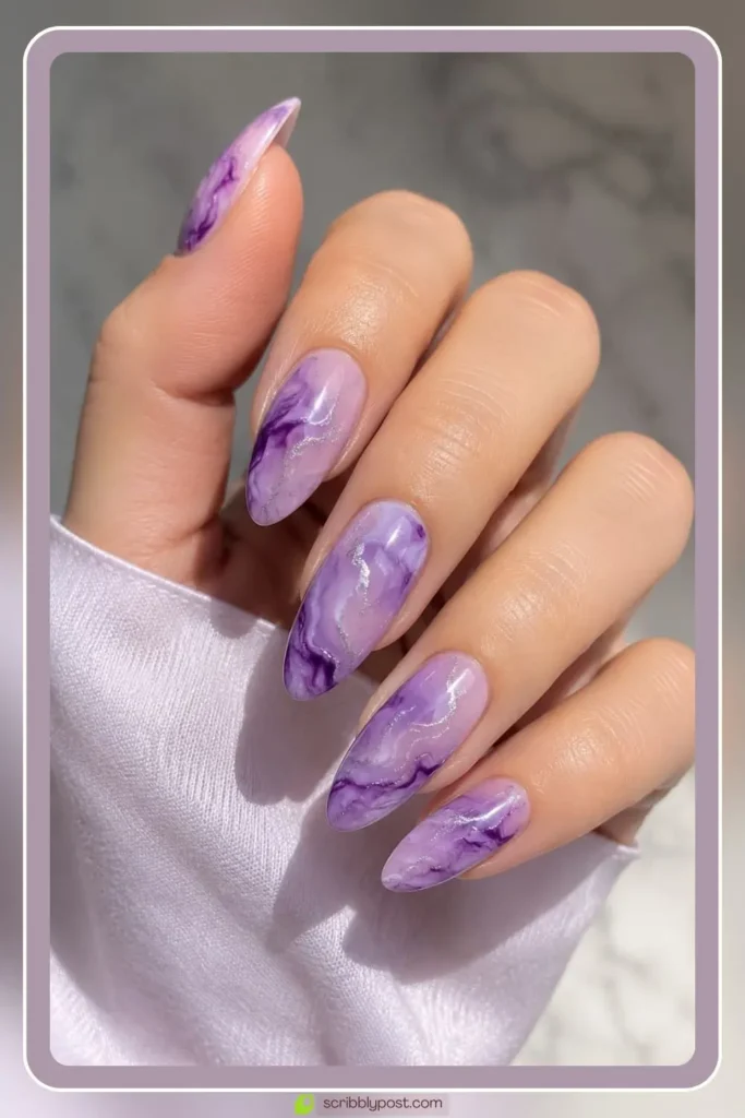 Lavender amethyst swirl marble nails on short oval shape with purple and violet swirling gel