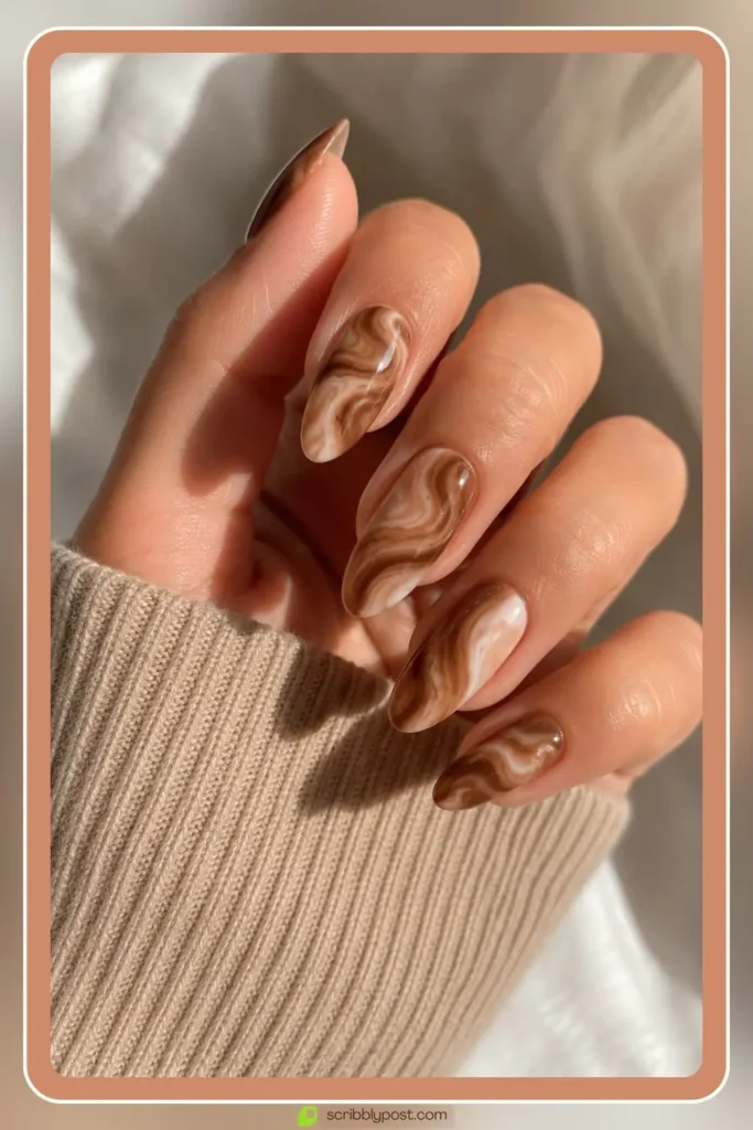 Mocha latte swirl marble nails on coffin shape with brown gel base and high shine glossy top coat
