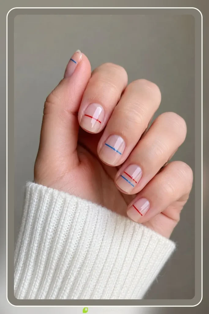 thin red and blue stripe lines on bare natural nail negative space short length