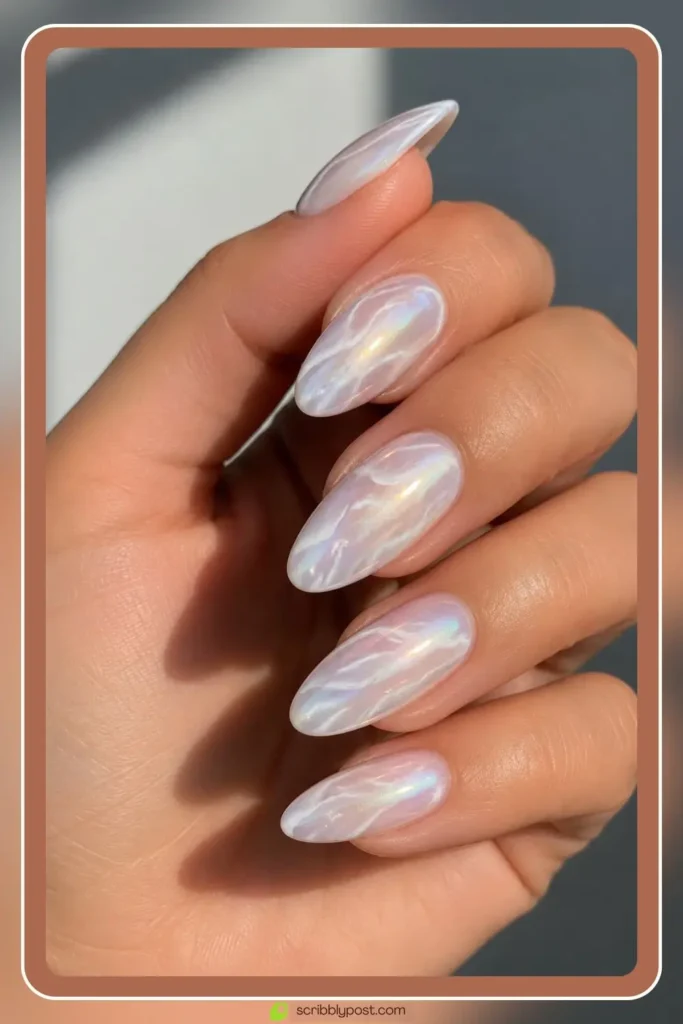 Pearl chrome marble nails on oval shape with pearl powder over white gel and mirror finish