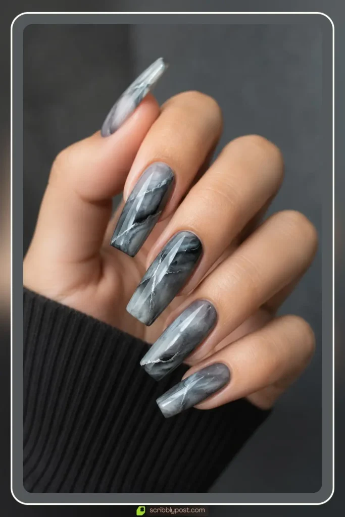 Smoky grey quartz marble nails on oval shape with charcoal base and matte top coat finish