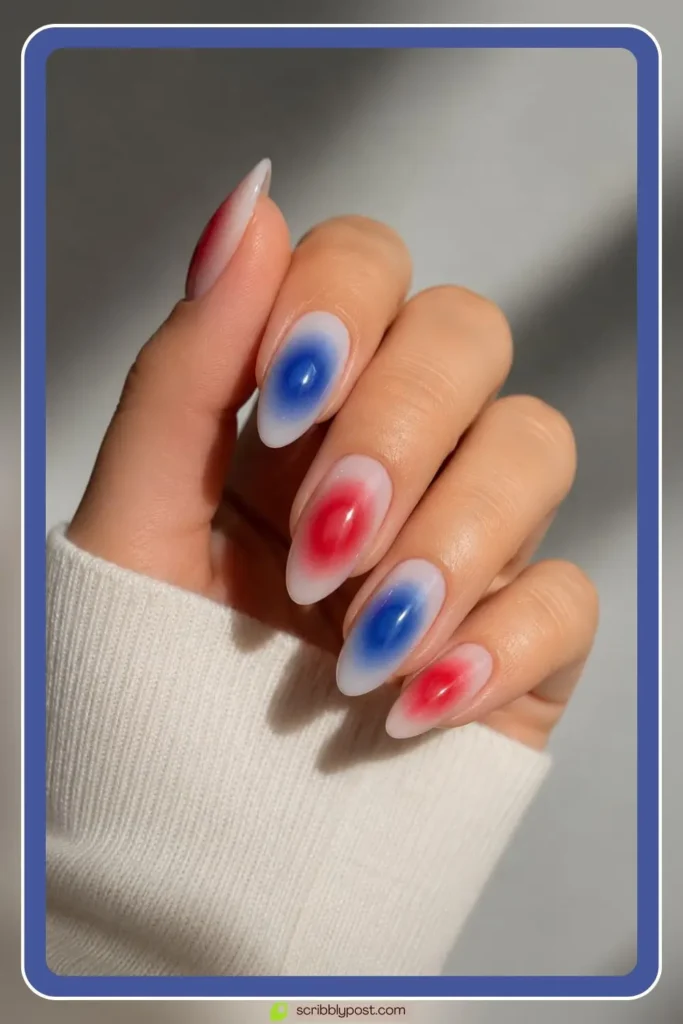 red and blue aura halo nails blurred sponge technique on medium almond length