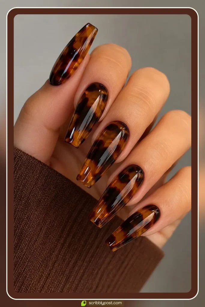 Glossy tortoise shell nails with deep glass like layered finish under thick top coat