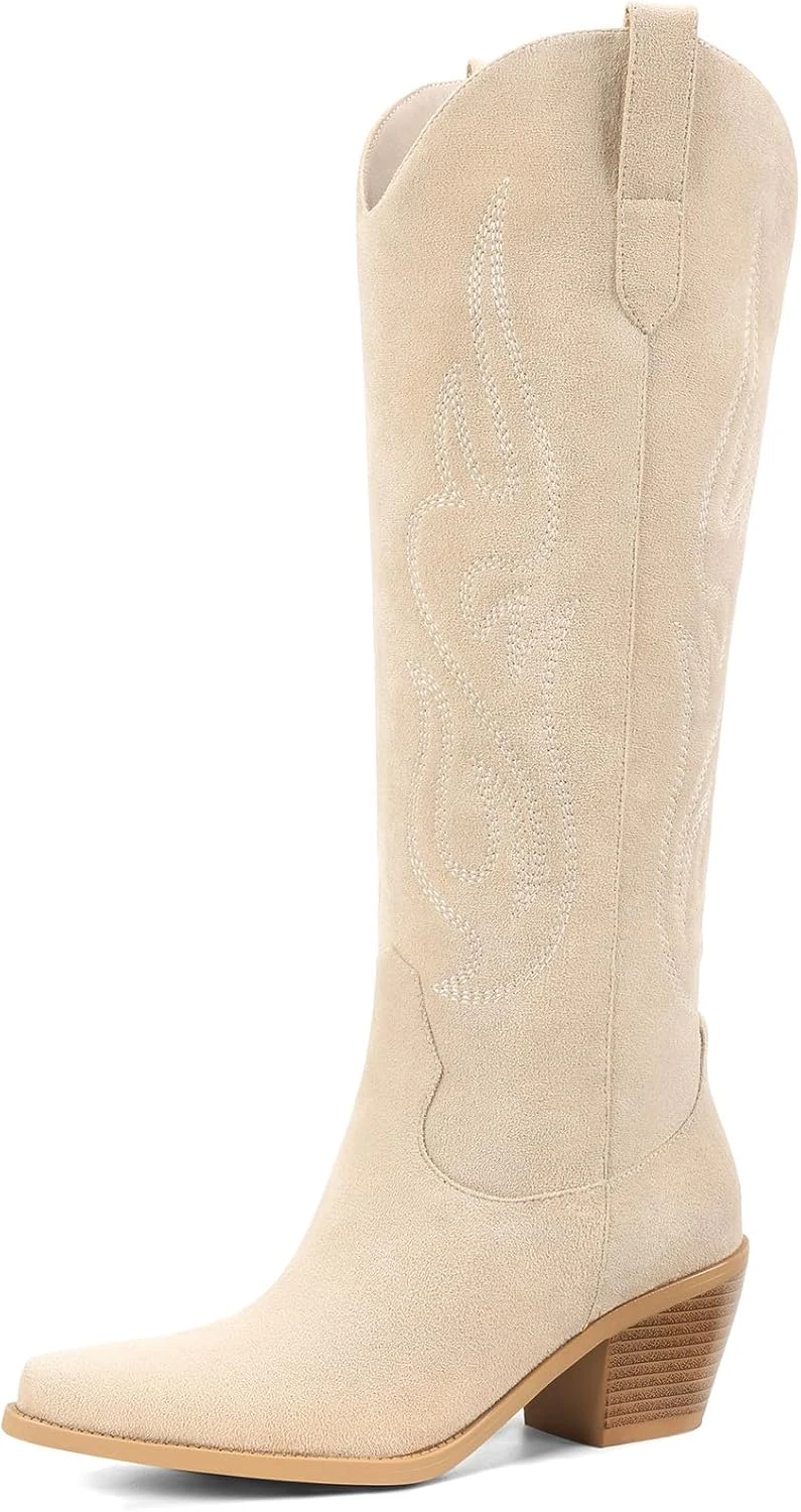 Tan cowboy boots paired with white boho mini dress