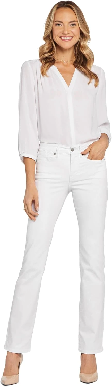 Women's clean straight leg white jeans for a leather jacket outfit
