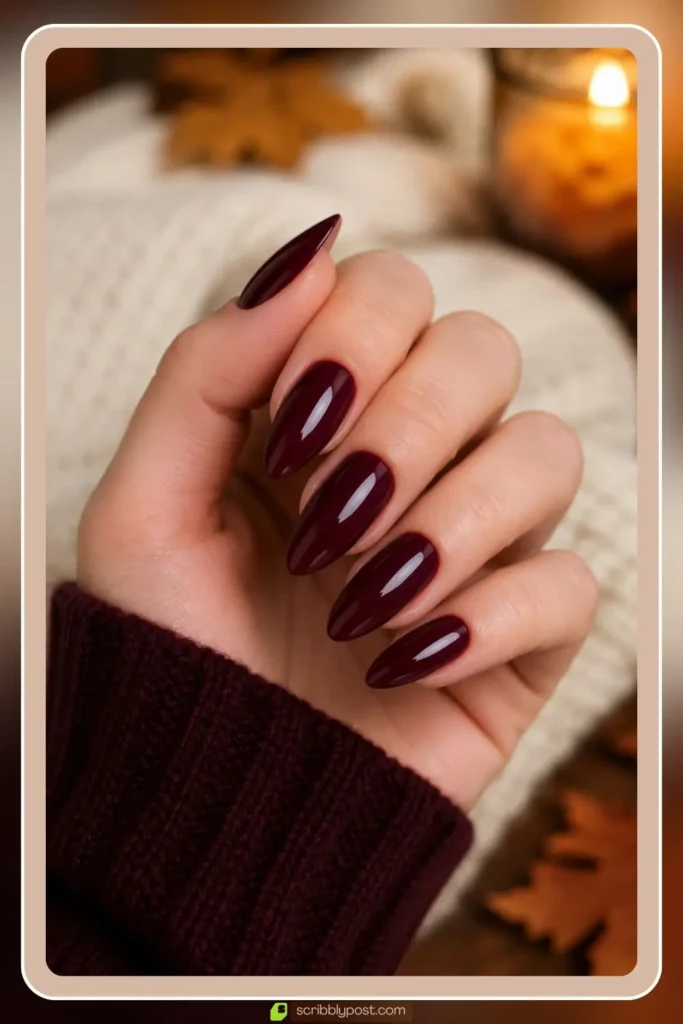Burgundy almond nails in glossy wine solid on medium length