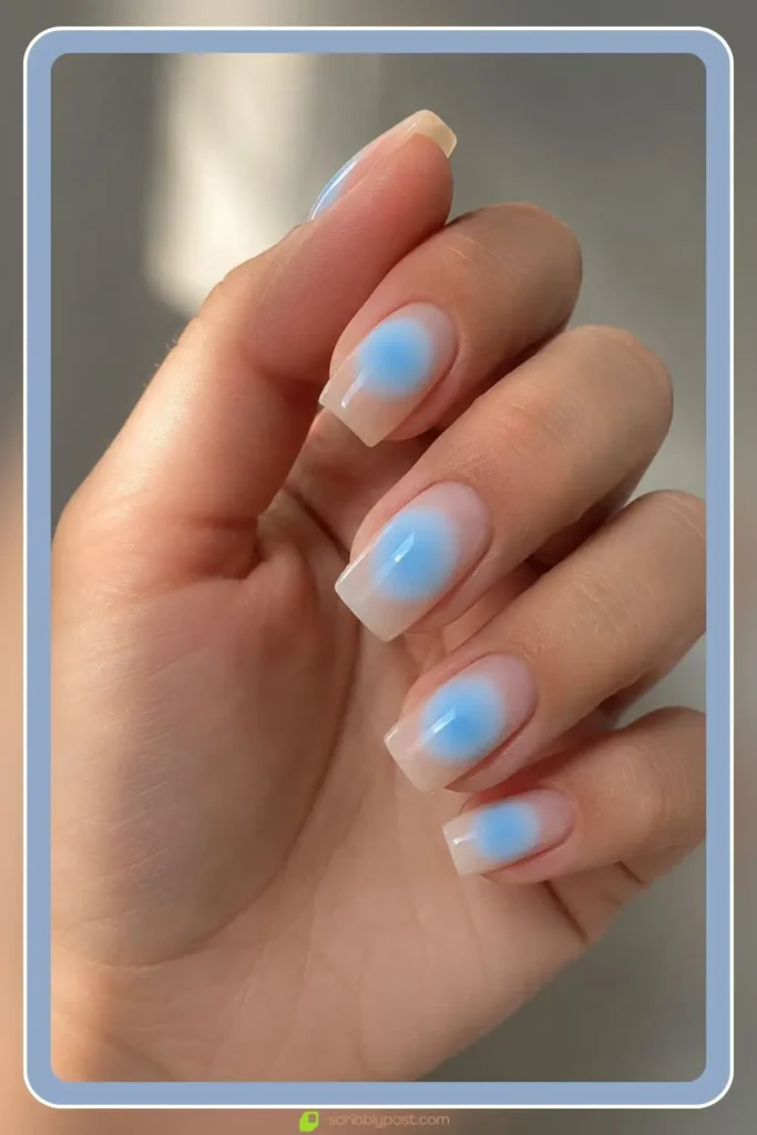 Baby blue aura orb on sheer nude square nails