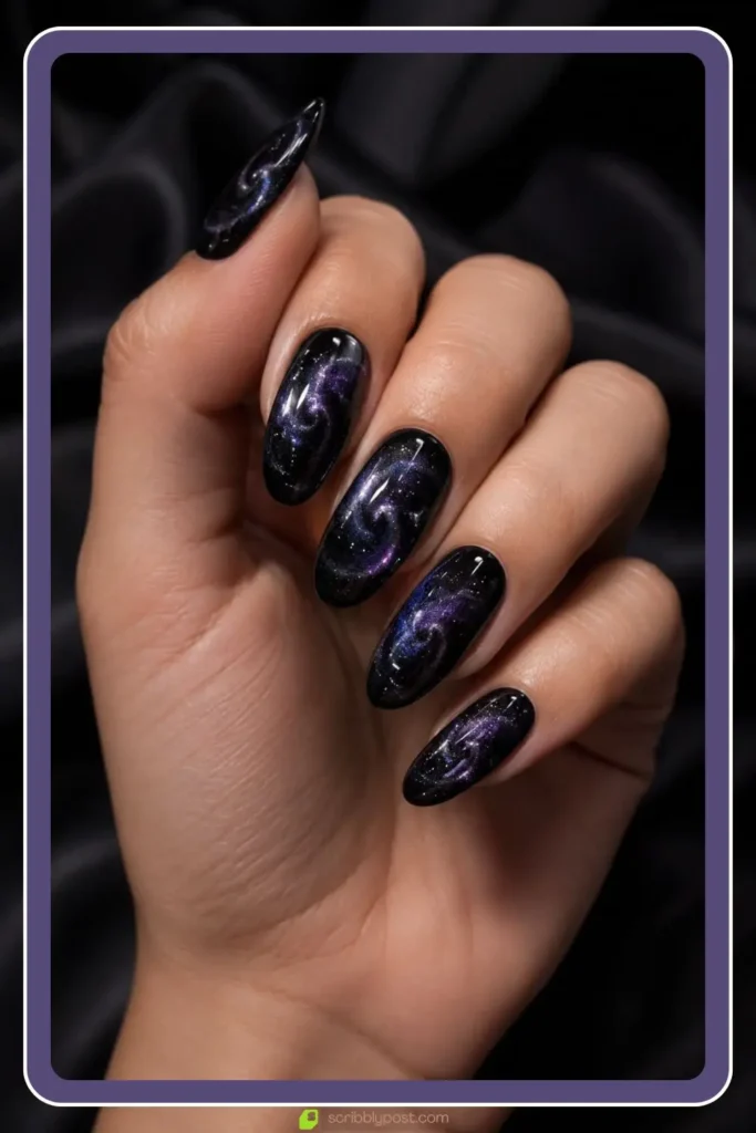 Black cat eye nails with galaxy swirl shimmer like a night sky