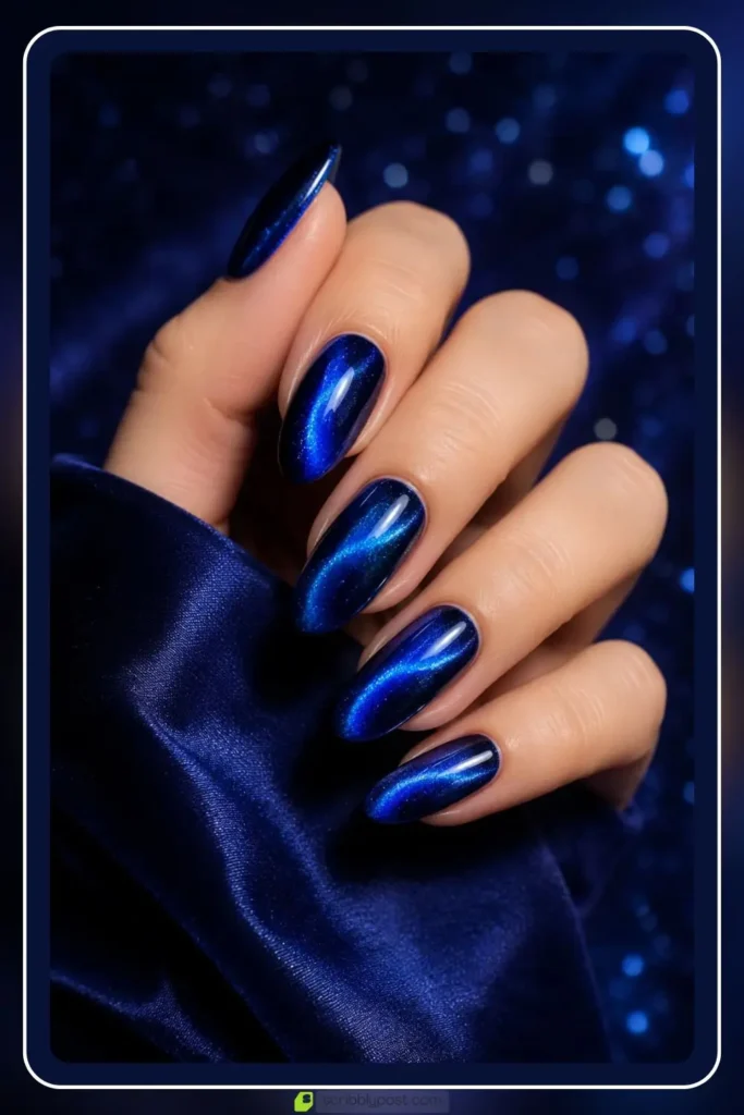 Blue cat eye nails with glowing sapphire shimmer band