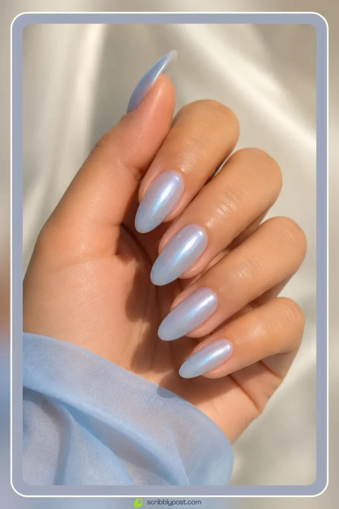 Blue glazed nails with pearl shimmer over milky base