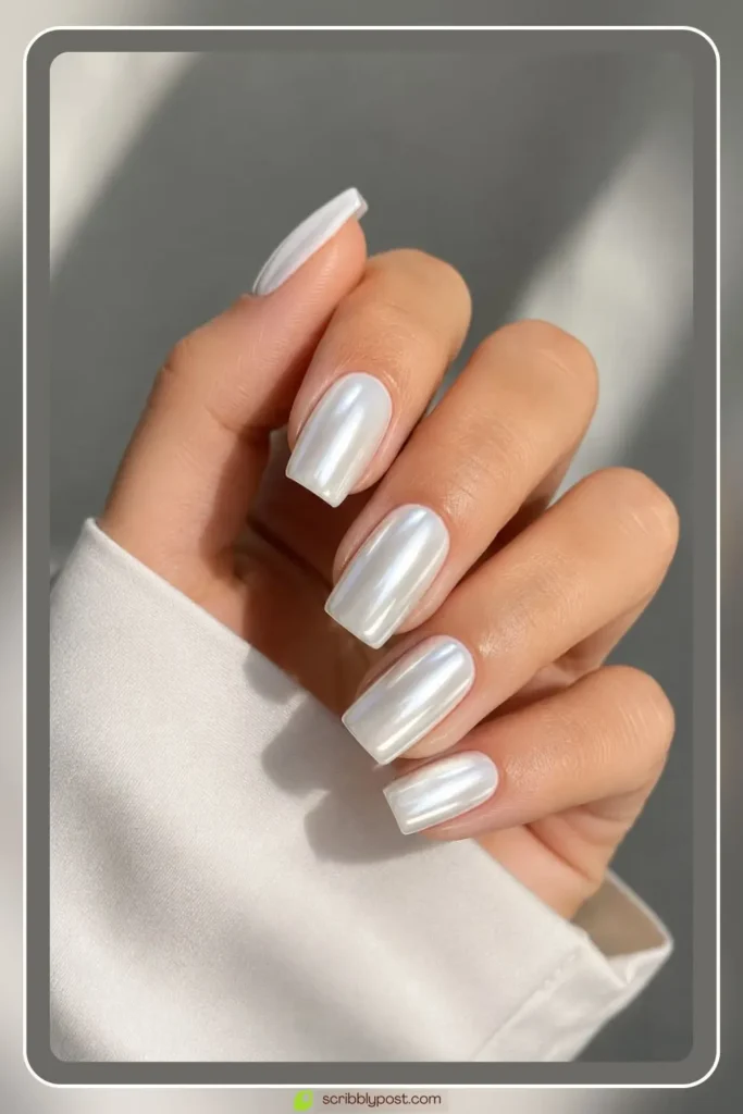 Bright white chrome nails with opaque metallic finish