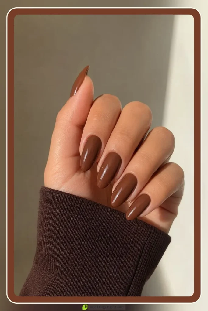 Brown almond nails in warm medium solid
