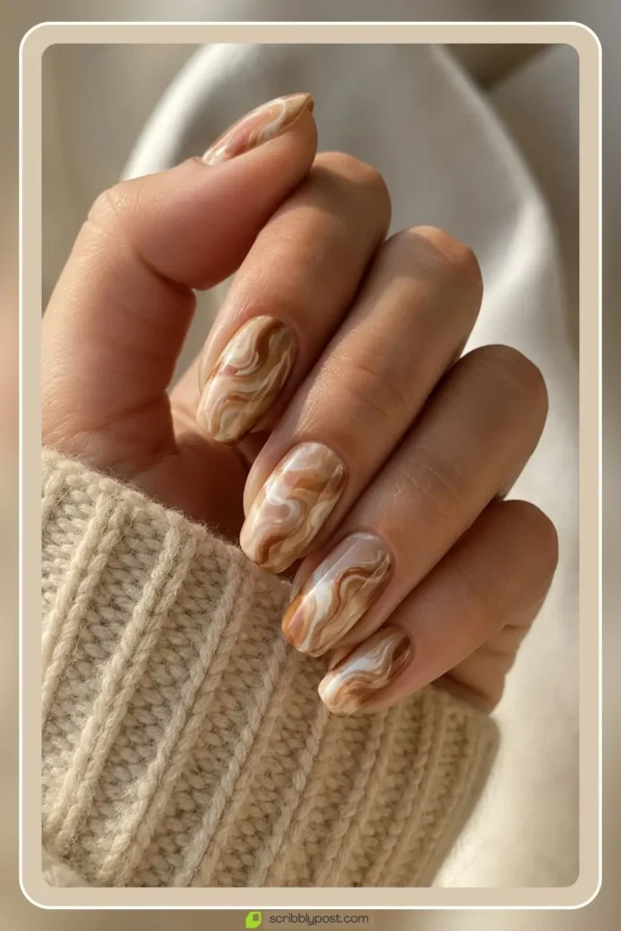Caramel and milk swirl nails in soft marbled brown