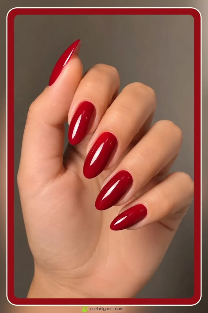 Red Nails for Every Plan: 16 Sets Sorted by the Occasion in 2026 1 Cherry red nails in glossy juicy solid on almond shape
