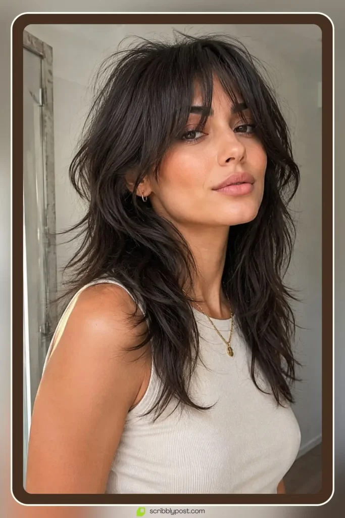 Classic wolf cut hairstyle with choppy crown layers and airy ends