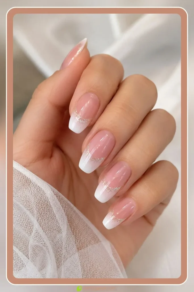 Pink white french fade with glitter line french ombre nails with glitter bridal