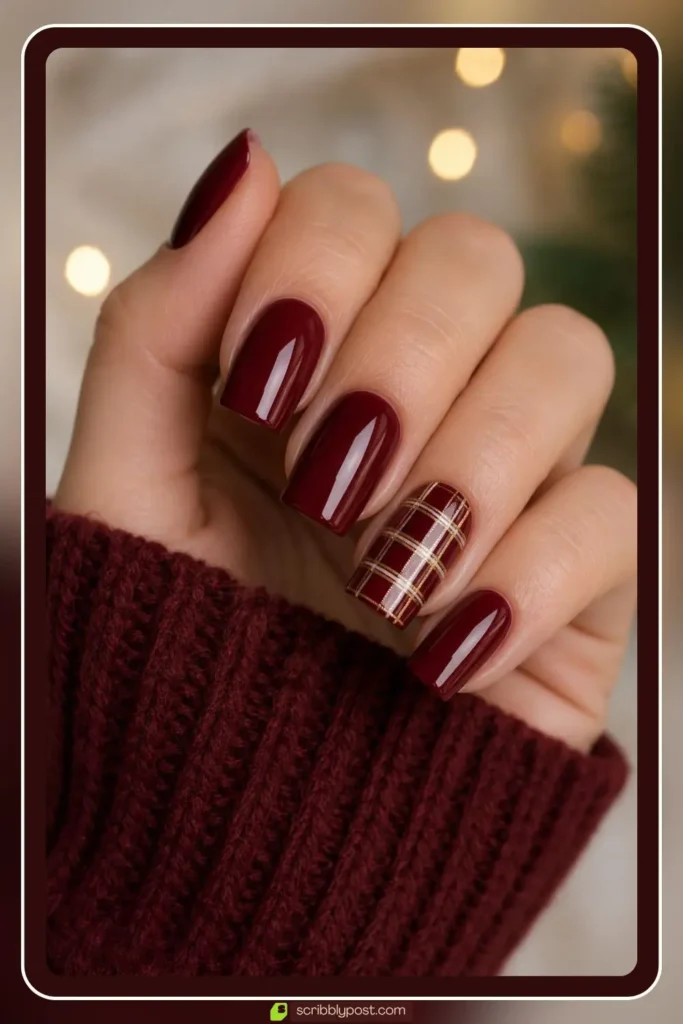 Burgundy nails with plaid accent nail in gold and cream lines