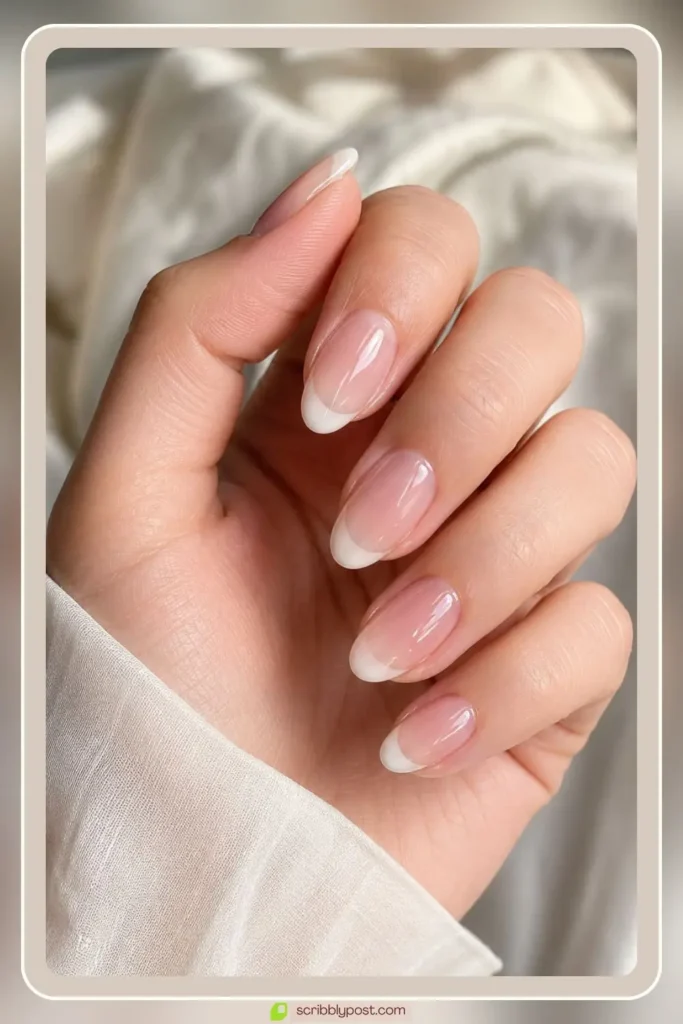 Jelly french tip nails with sheer white tips over translucent base