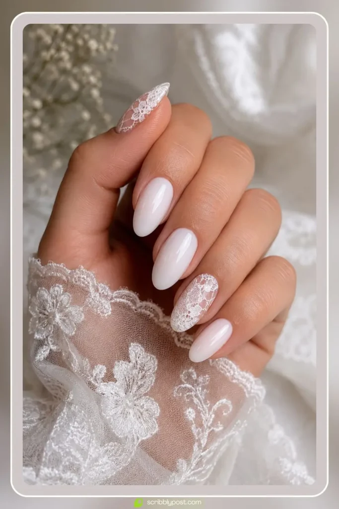 White nails with delicate lace pattern detail on sheer base
