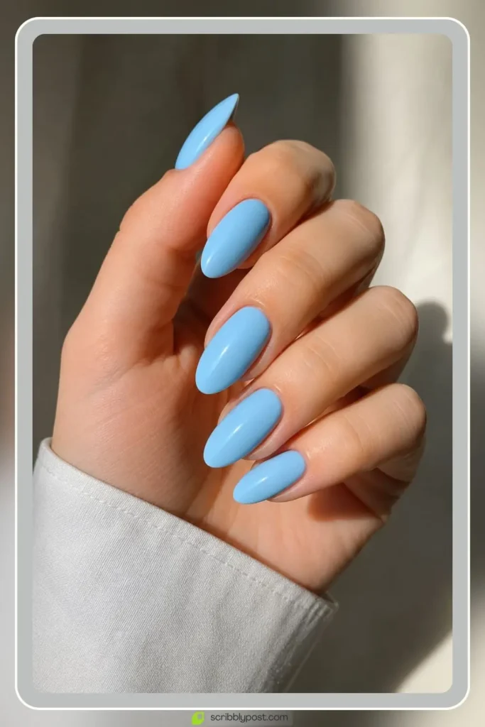 Light blue nails in classic almond shape solid