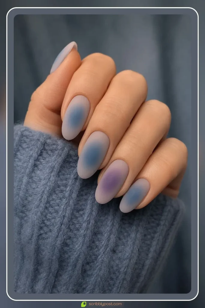 Matte dusty blue aura nails with velvet soft finish