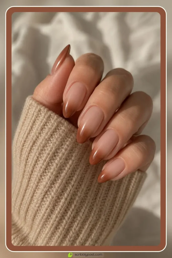Brown ombre nails fading from nude to warm brown at tips
