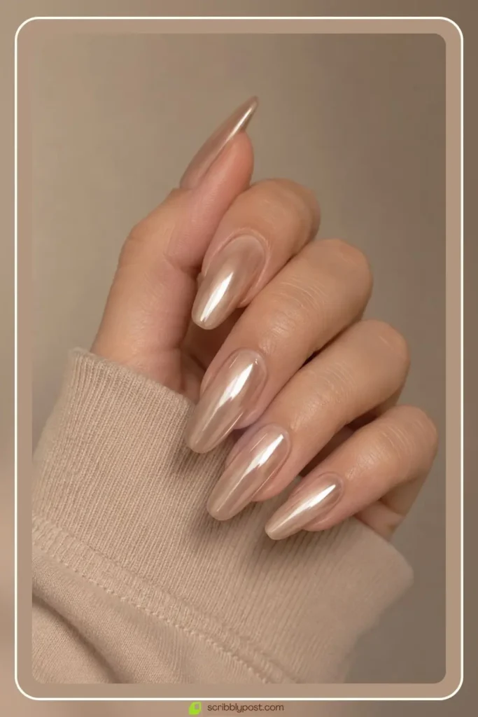 Nude chrome nails with soft beige metallic glaze