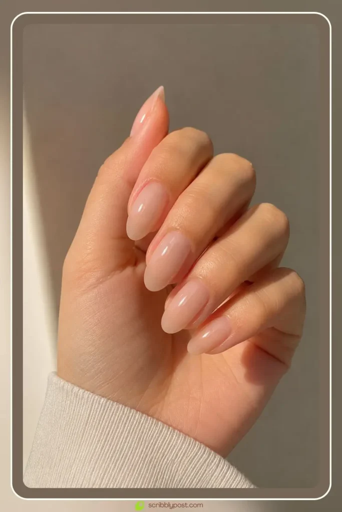 Nude jelly nails with sheer veil finish on natural nails