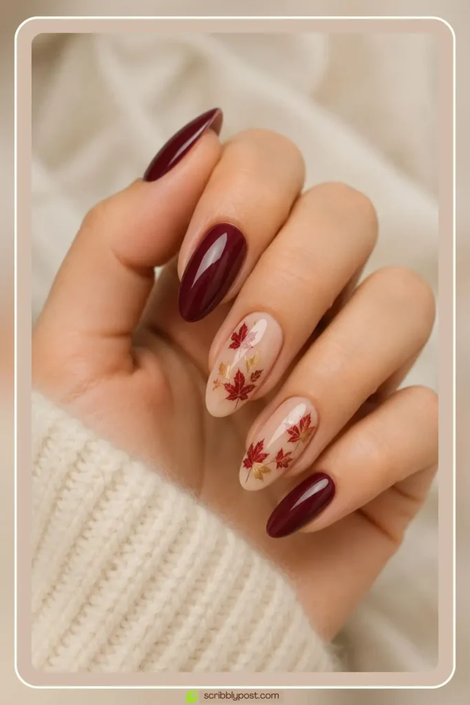 Nude and burgundy nails with gold leaf art accents for fall