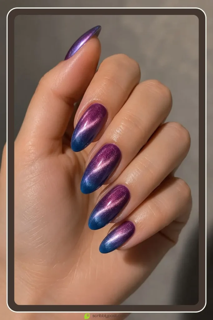 Ombre cat eye nails fading from purple to blue with shimmer band