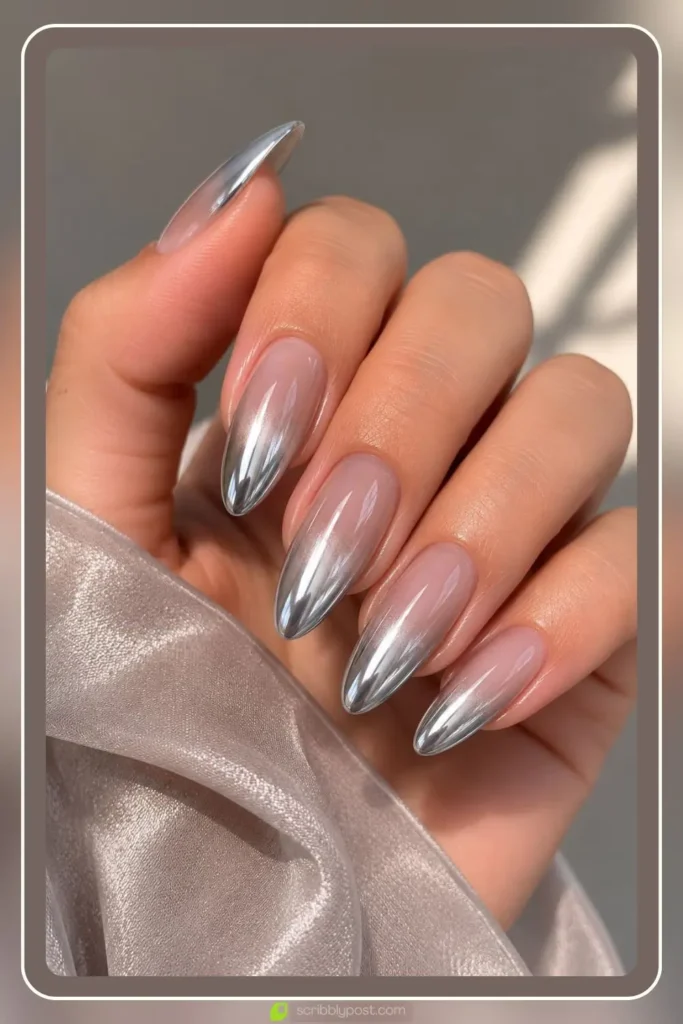 Ombre chrome nails fading from silver to sheer gray