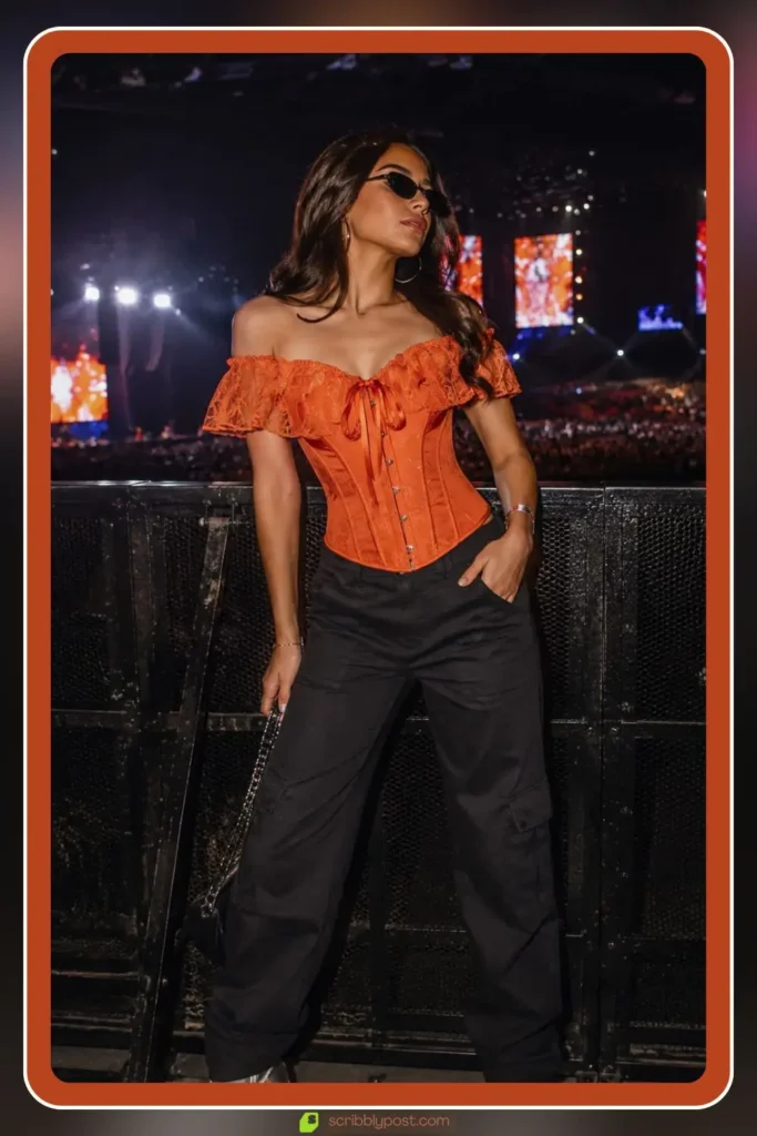 Bold orange concert outfit with statement pieces
