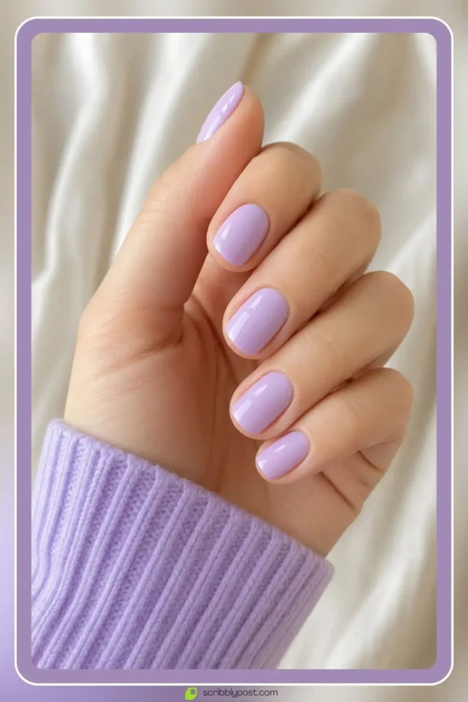 Pastel purple nails in soft milky wash on short nails