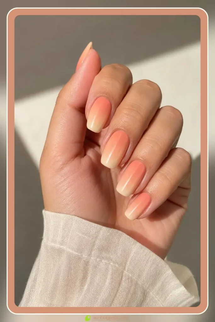 Soft peach to cream gradient peach ombre nails for summer