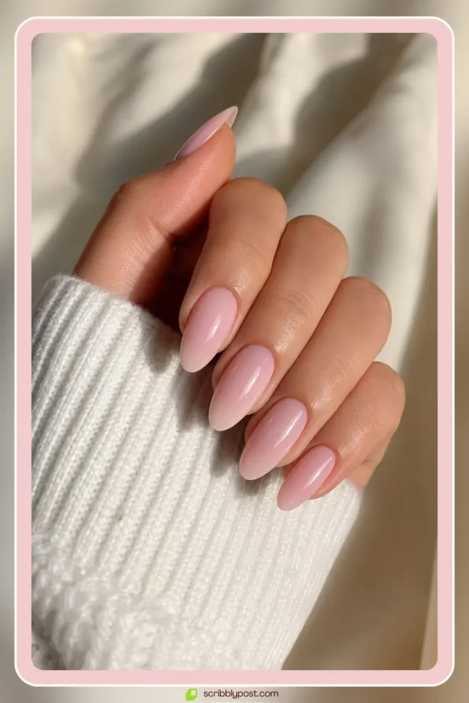 Pink almond nails in classic salon set with glossy finish