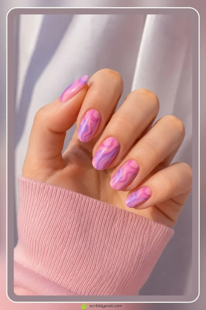 Pink and purple nails with swirled two tone design