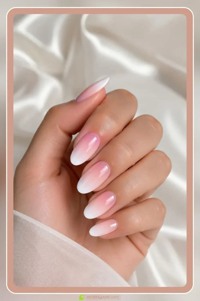 Soft pink melting into white pink and white ombre nails bridal