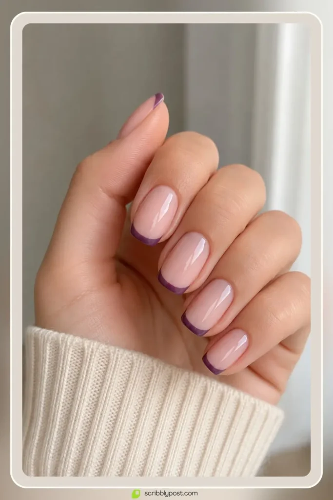 Purple french tip nails with violet tips on nude base