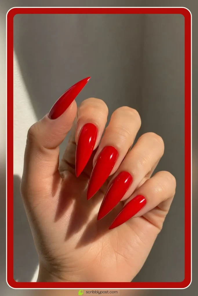 Red Nails for Every Plan: 16 Sets Sorted by the Occasion in 2026 57 Long red acrylic nails in sharp stiletto shape