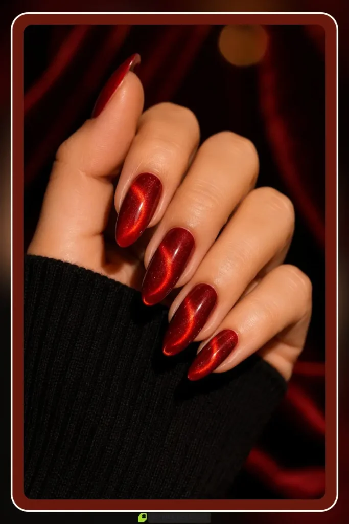 Red Nails for Every Plan: 16 Sets Sorted by the Occasion in 2026 9 Red cat eye nails with glowing crimson shimmer band