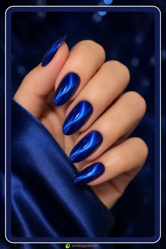 Royal blue cat eye nails with sapphire shimmer stripe