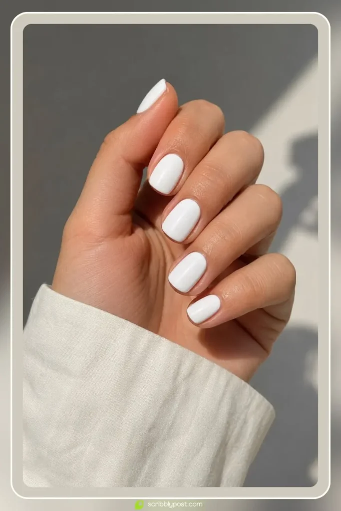 Short white nails on natural length with crisp clean finish