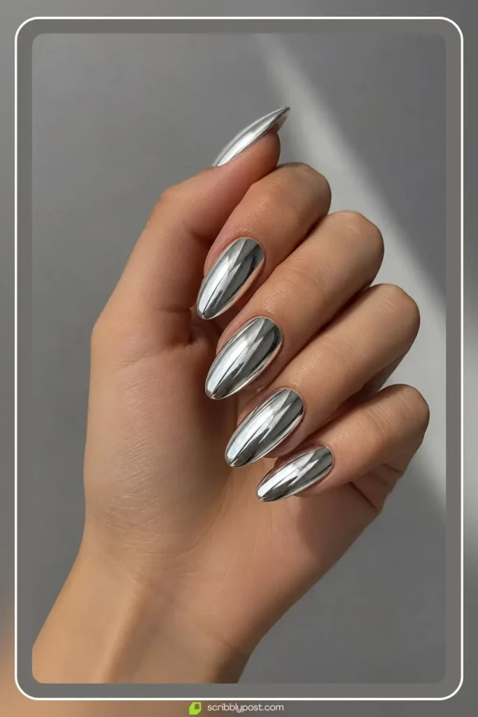Silver mirror chrome nails with full reflection on almond shape