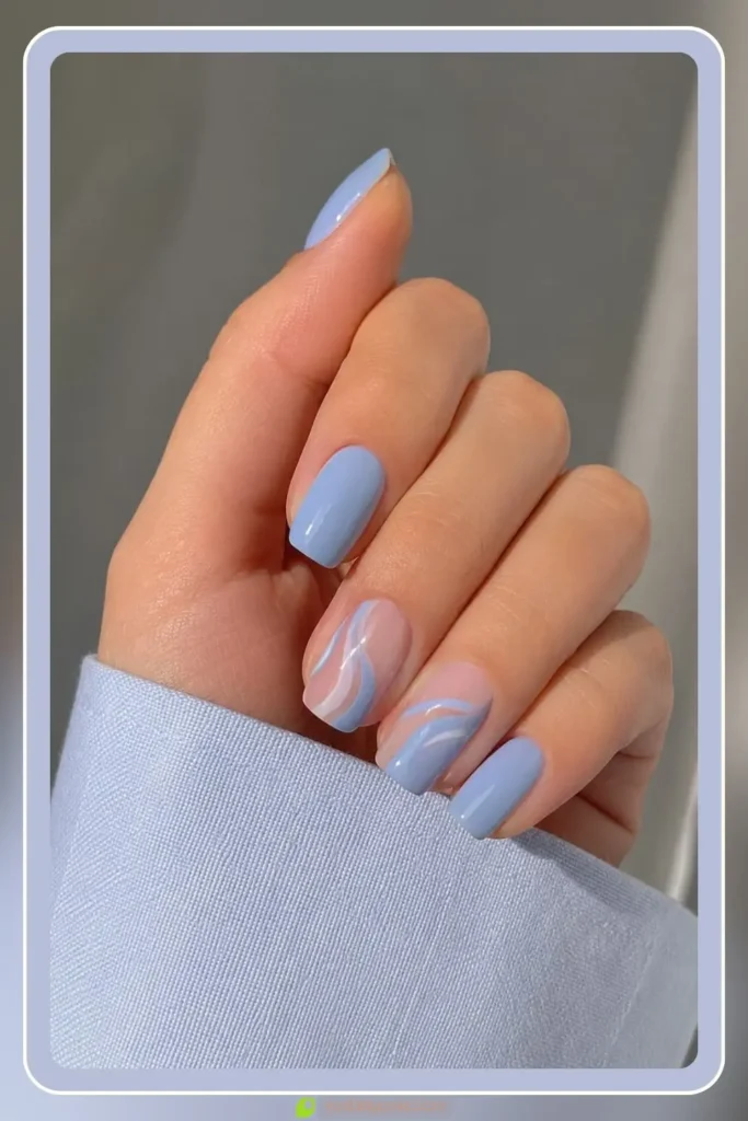 Pale blue base with one white swirl, Simple Blue Nail Designs, modern minimal manicure